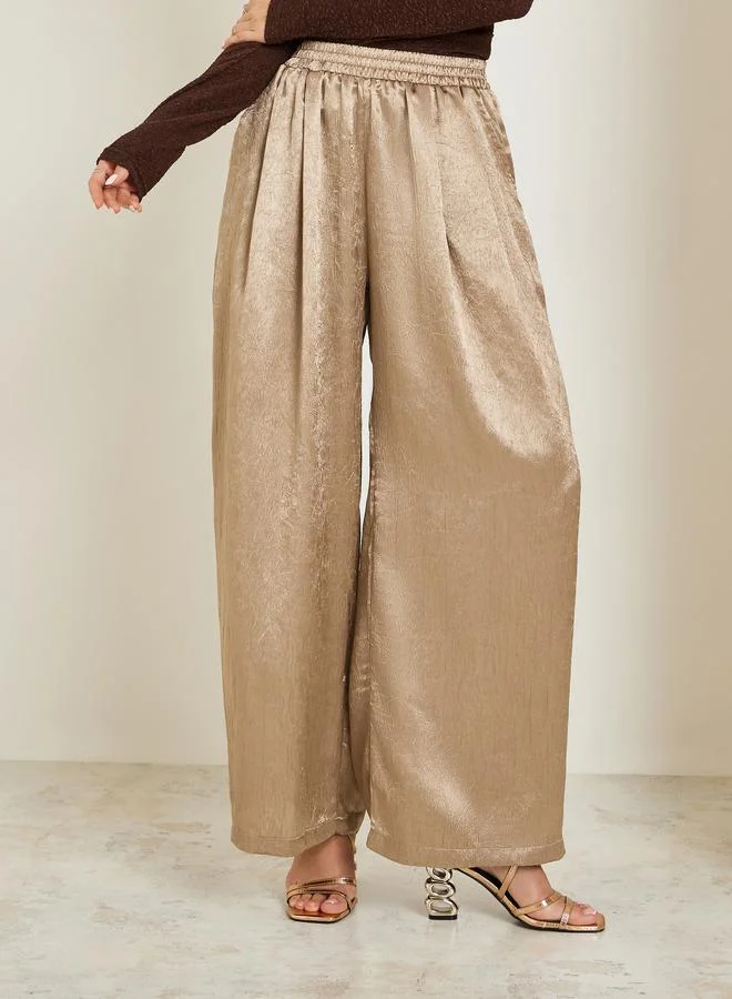 Styli Women Gold Shimmer Wide Leg Trousers